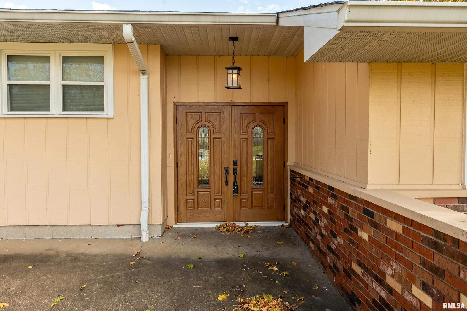 9784 Highway 127 Murphysboro, IL 62966 - Photo 6 of 60 a front view of a house with garage