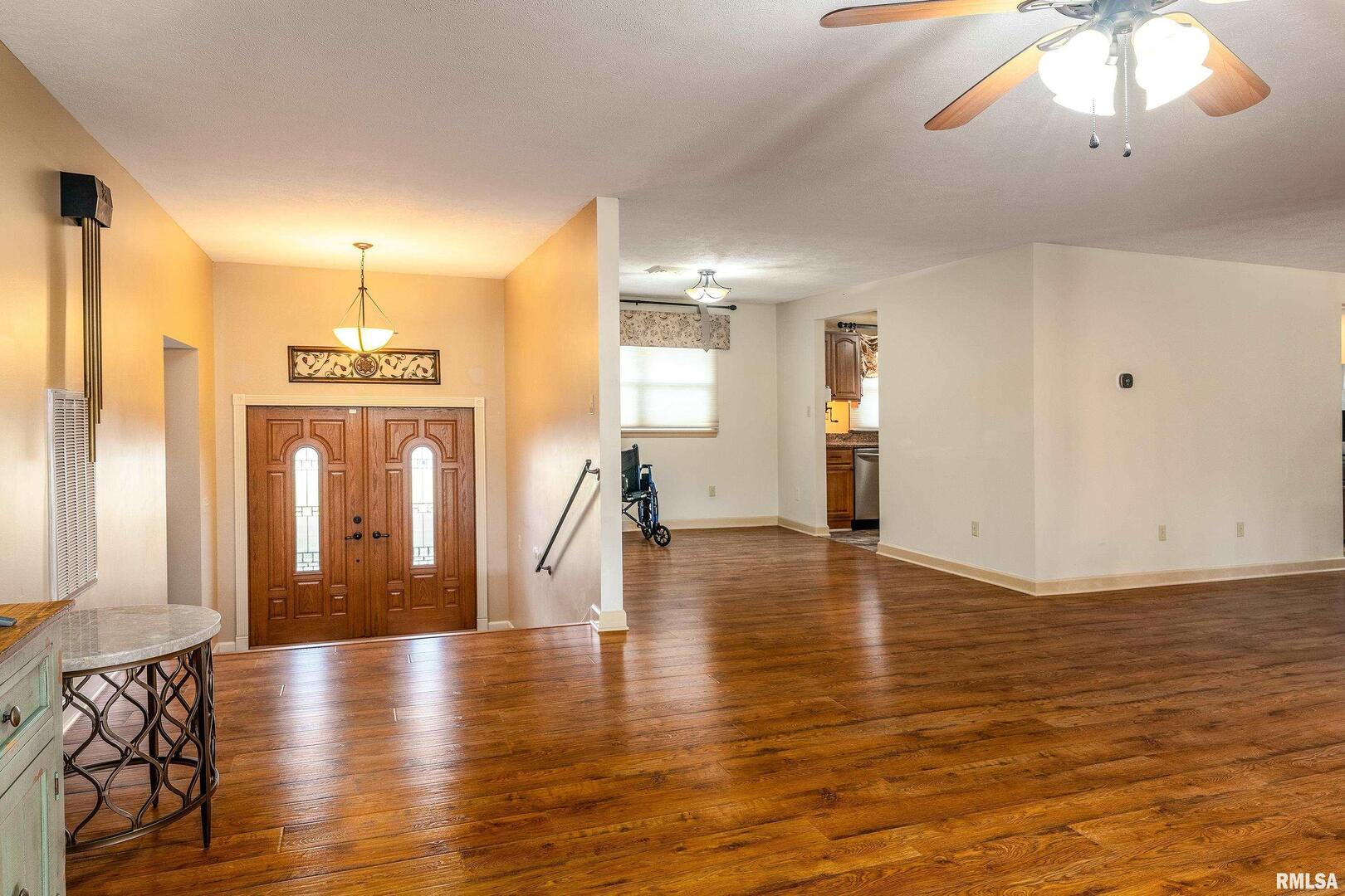 9784 Highway 127 Murphysboro, IL 62966 - Photo 8 of 60 a view of a livingroom with furniture wooden floor and chandelier