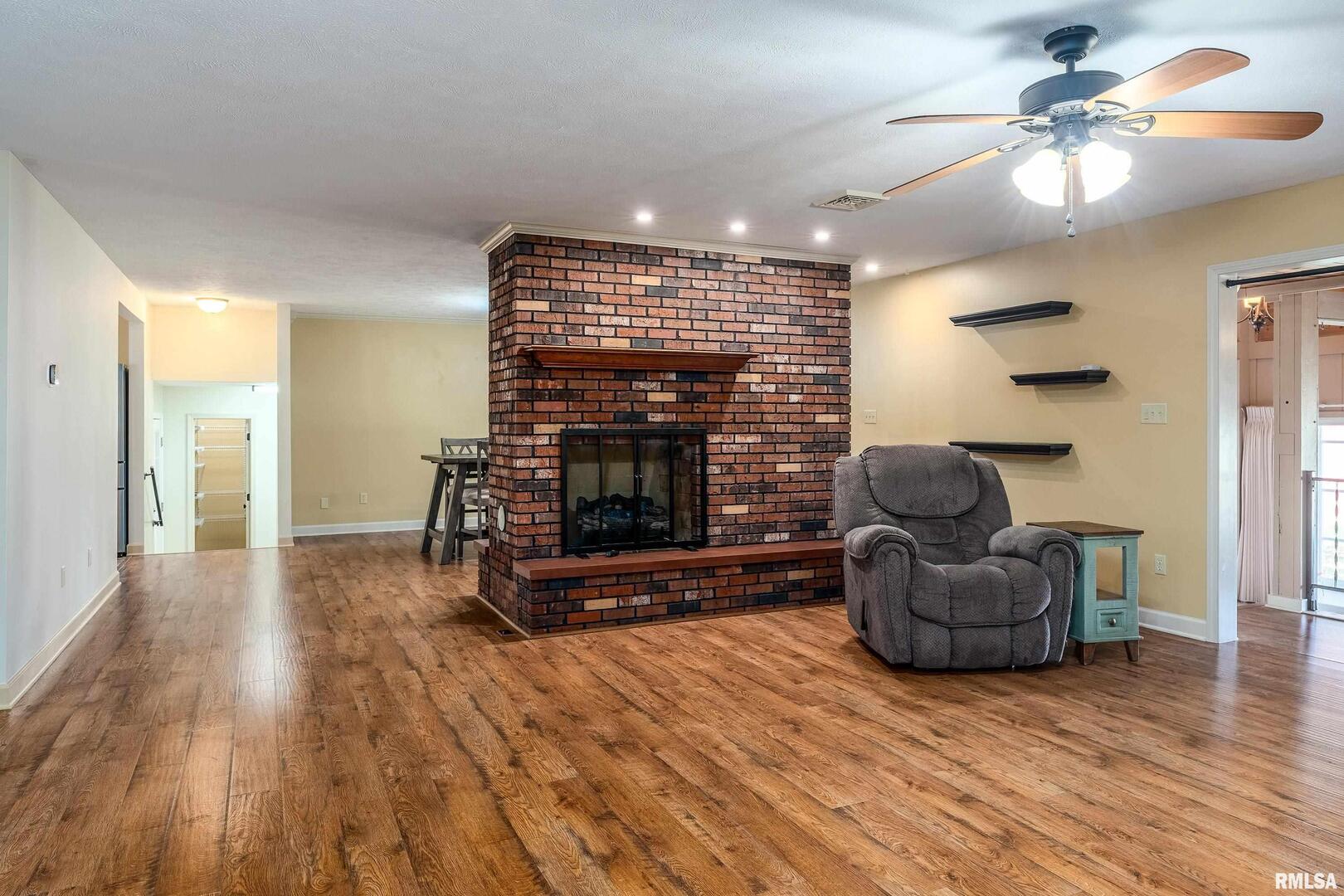 9784 Highway 127 Murphysboro, IL 62966 - Photo 10 of 60 a living room with furniture and a fireplace