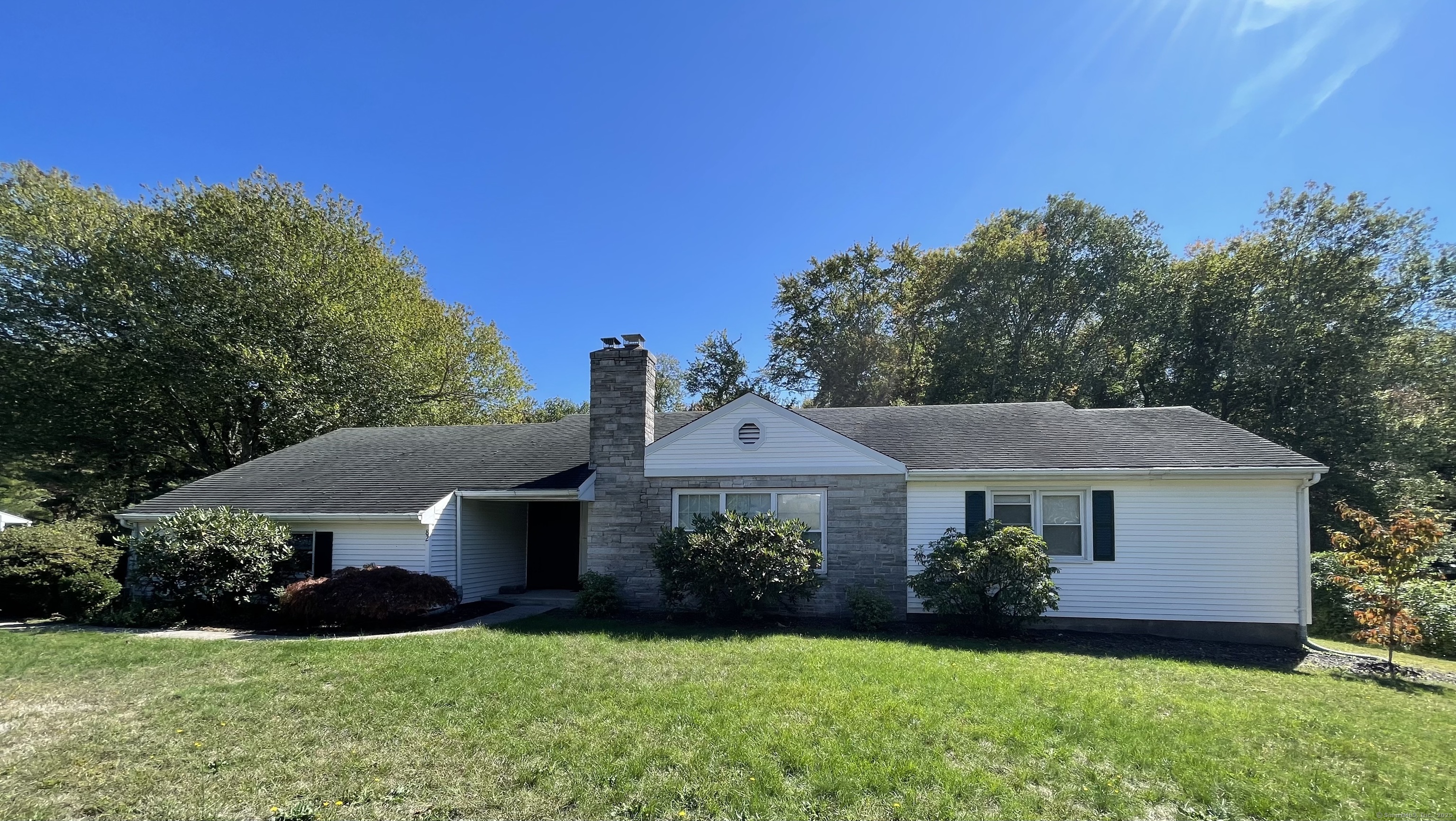 82 North High Street Clinton, CT 06413 - Photo 1 of 1 a front view of a house with a yard and garage