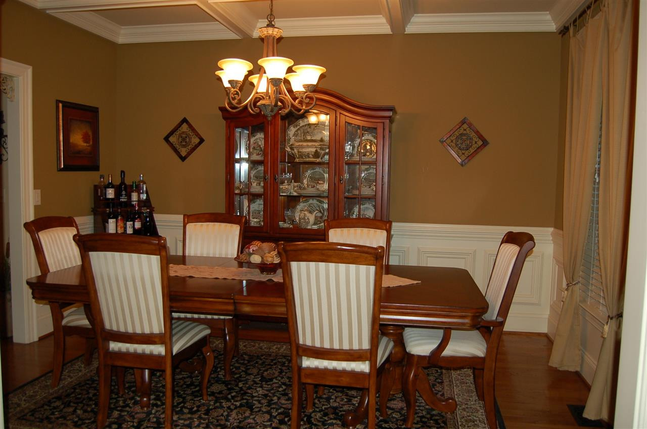 8111 Henderson Road Apex, NC 27539 - Photo 7 of 25 Coffered ceilings and heavy molding throughout Dining Room