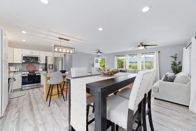 a bedroom with two beds and a window