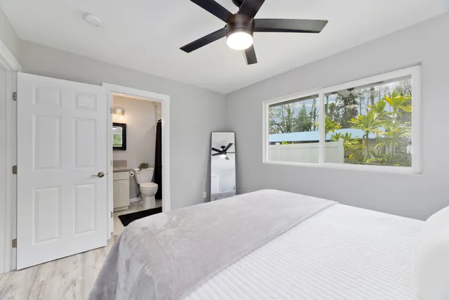 a bathroom with a toilet sink and shower