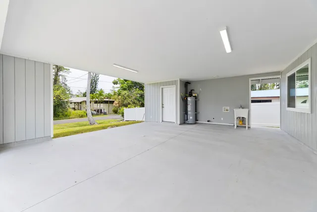 a view of livingroom with yard and front door