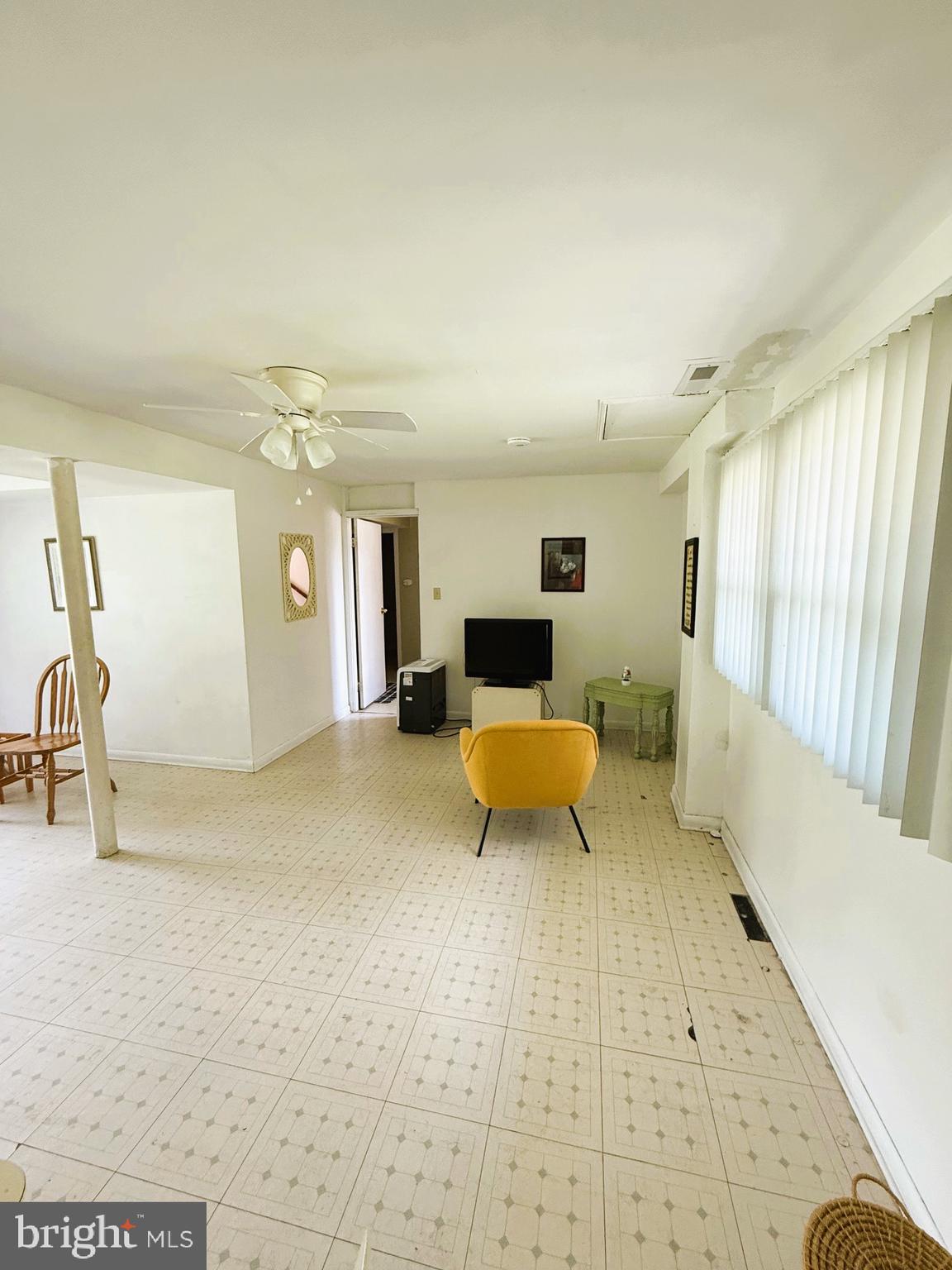 13 Thomas Drive Bridgeton, NJ 08302 - Photo 12 of 18 a living room with furniture and a table