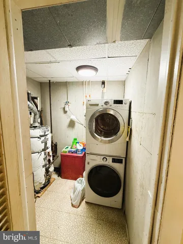 a close view of a utility room with dryer and washer