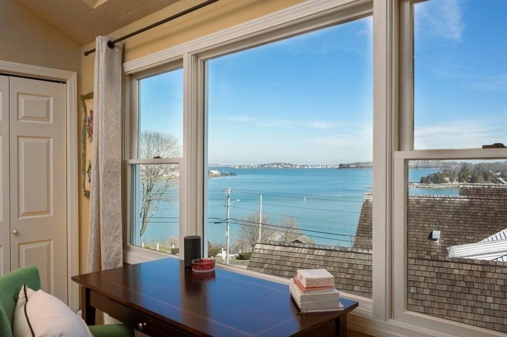 6 Governor Long Road Hingham, MA 02043 - Photo 19 of 24 a view of a balcony with a table and chairs