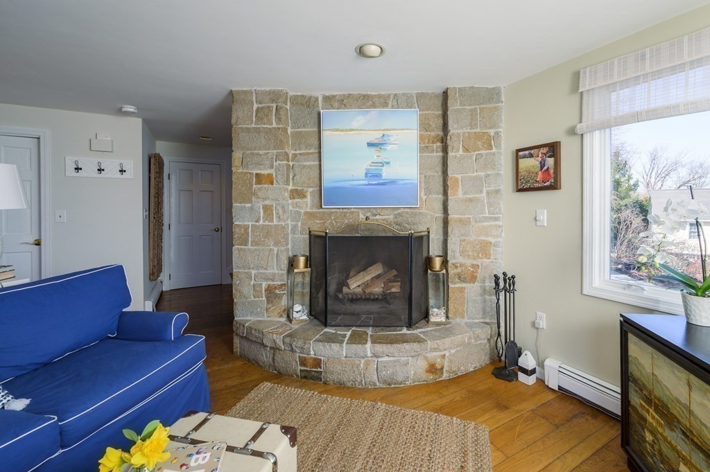 6 Governor Long Road Hingham, MA 02043 - Photo 10 of 24 a living room with furniture and a fireplace