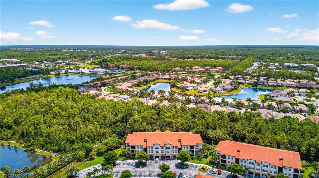 12955 Positano Circle, Unit 305 Naples, FL 34105 - Photo 10 of 10 Aerial view of residential area with a large body of water