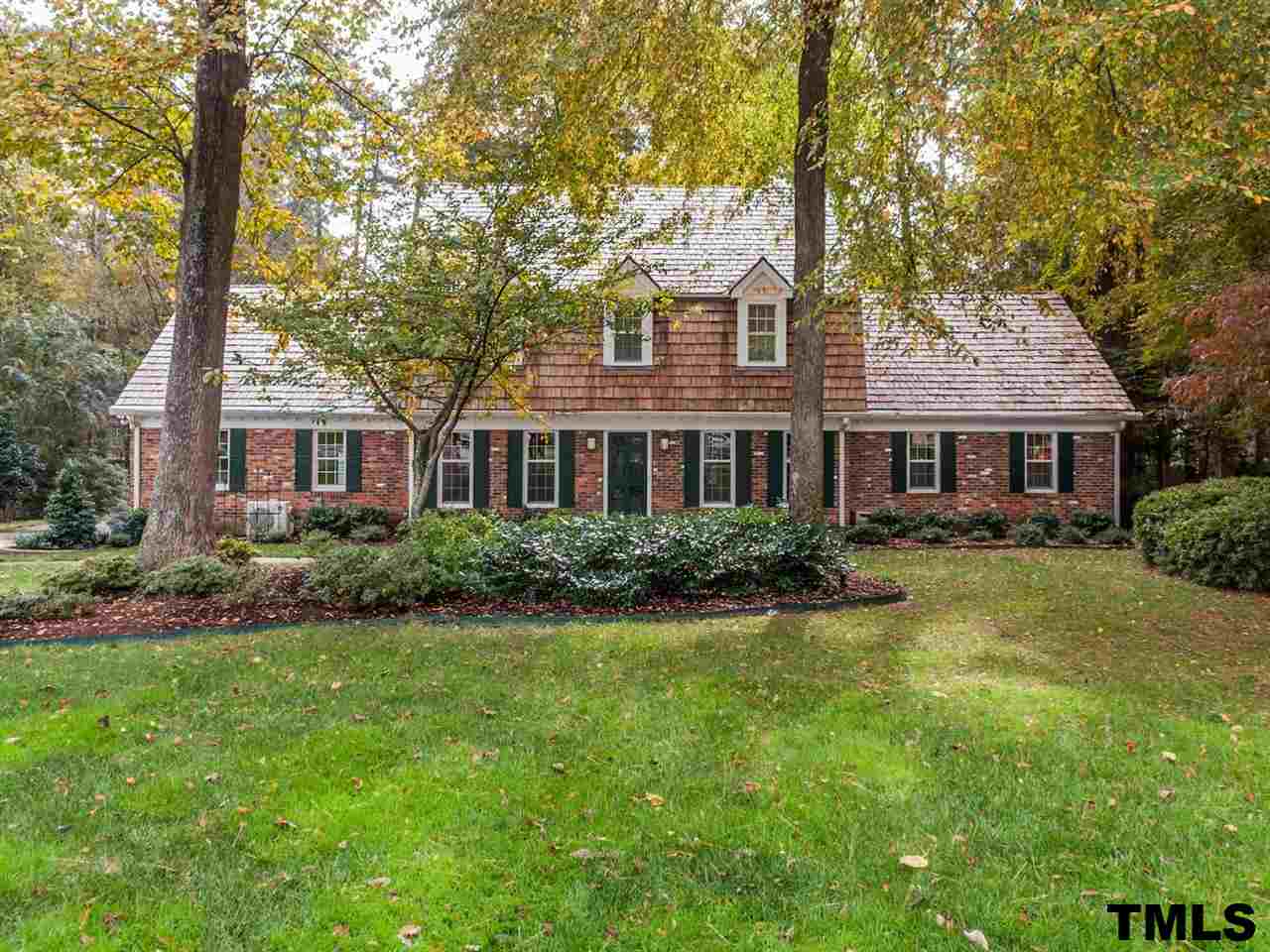 1804 Pony Run Road Raleigh, NC 27615 - Photo 1 of 25 a front view of a house with a yard and trees