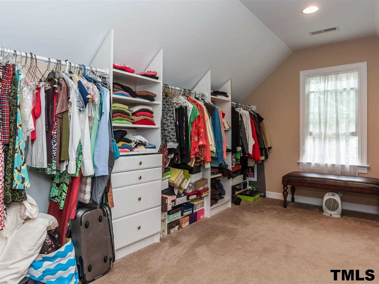 1804 Pony Run Road Raleigh, NC 27615 - Photo 15 of 25 a view of walk in closet with clothes and shoes