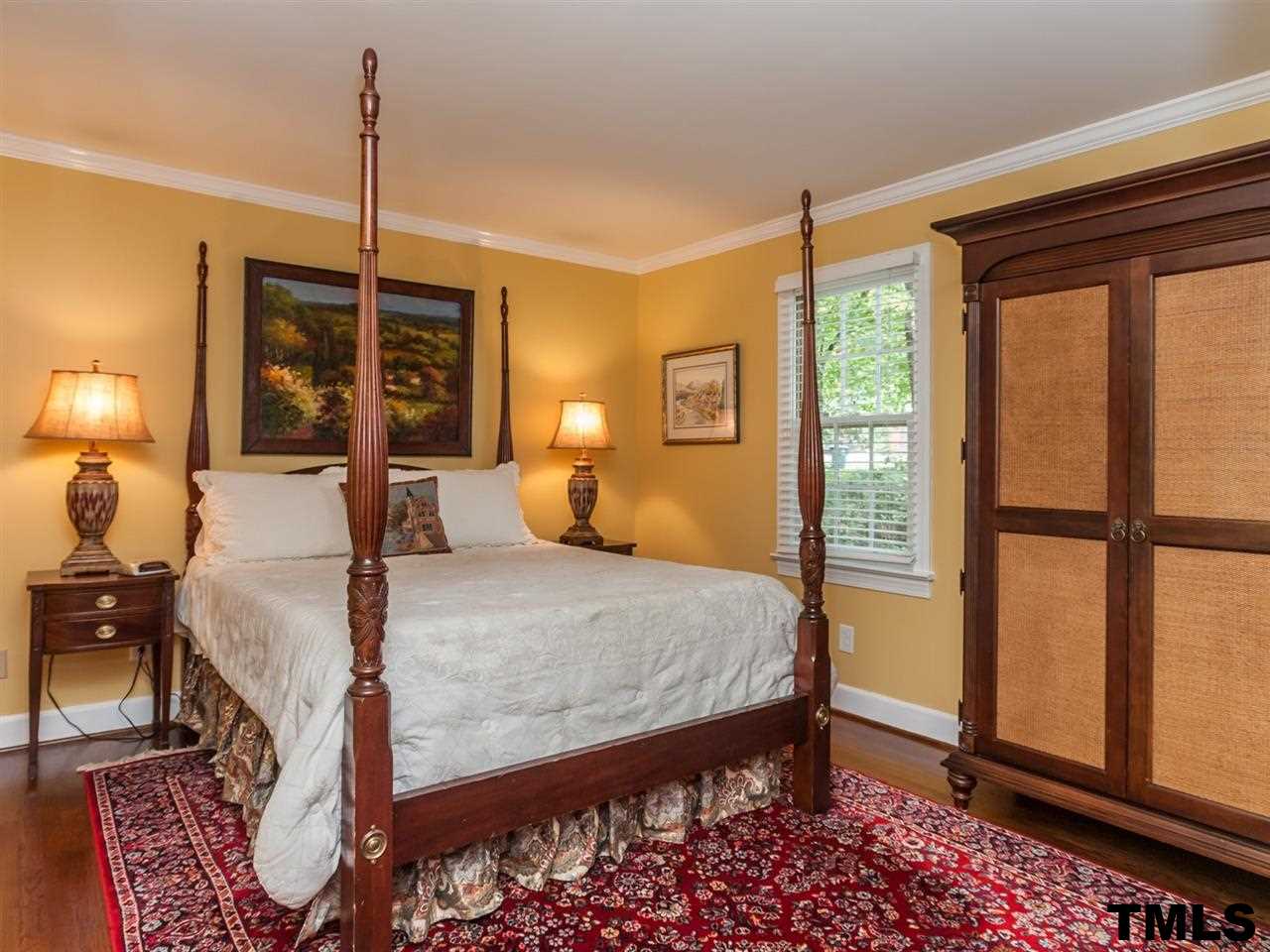 1804 Pony Run Road Raleigh, NC 27615 - Photo 16 of 25 a bed room with a bed and a window