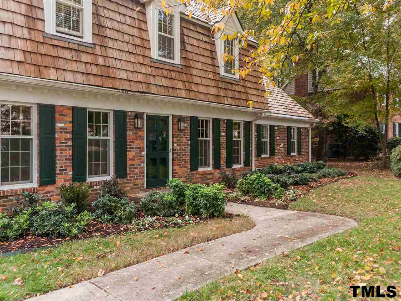 1804 Pony Run Road Raleigh, NC 27615 - Photo 2 of 25 front view of a brick house with a yard
