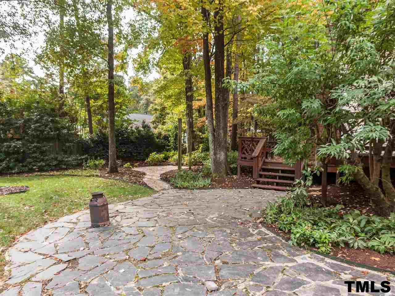 1804 Pony Run Road Raleigh, NC 27615 - Photo 22 of 25 a view of a table and chairs in the garden