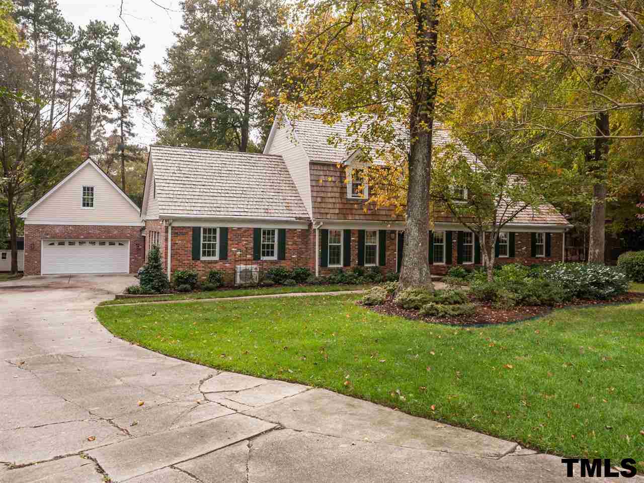 1804 Pony Run Road Raleigh, NC 27615 - Photo 25 of 25 a front view of a house with a garden and porch