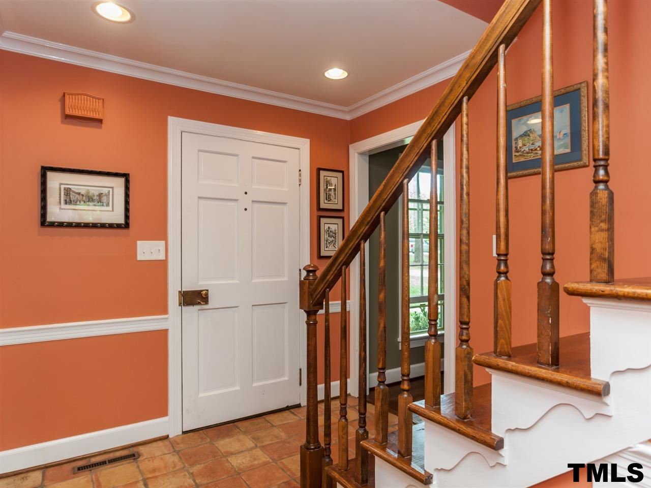 1804 Pony Run Road Raleigh, NC 27615 - Photo 3 of 25 a view of an entryway with wooden floor and door