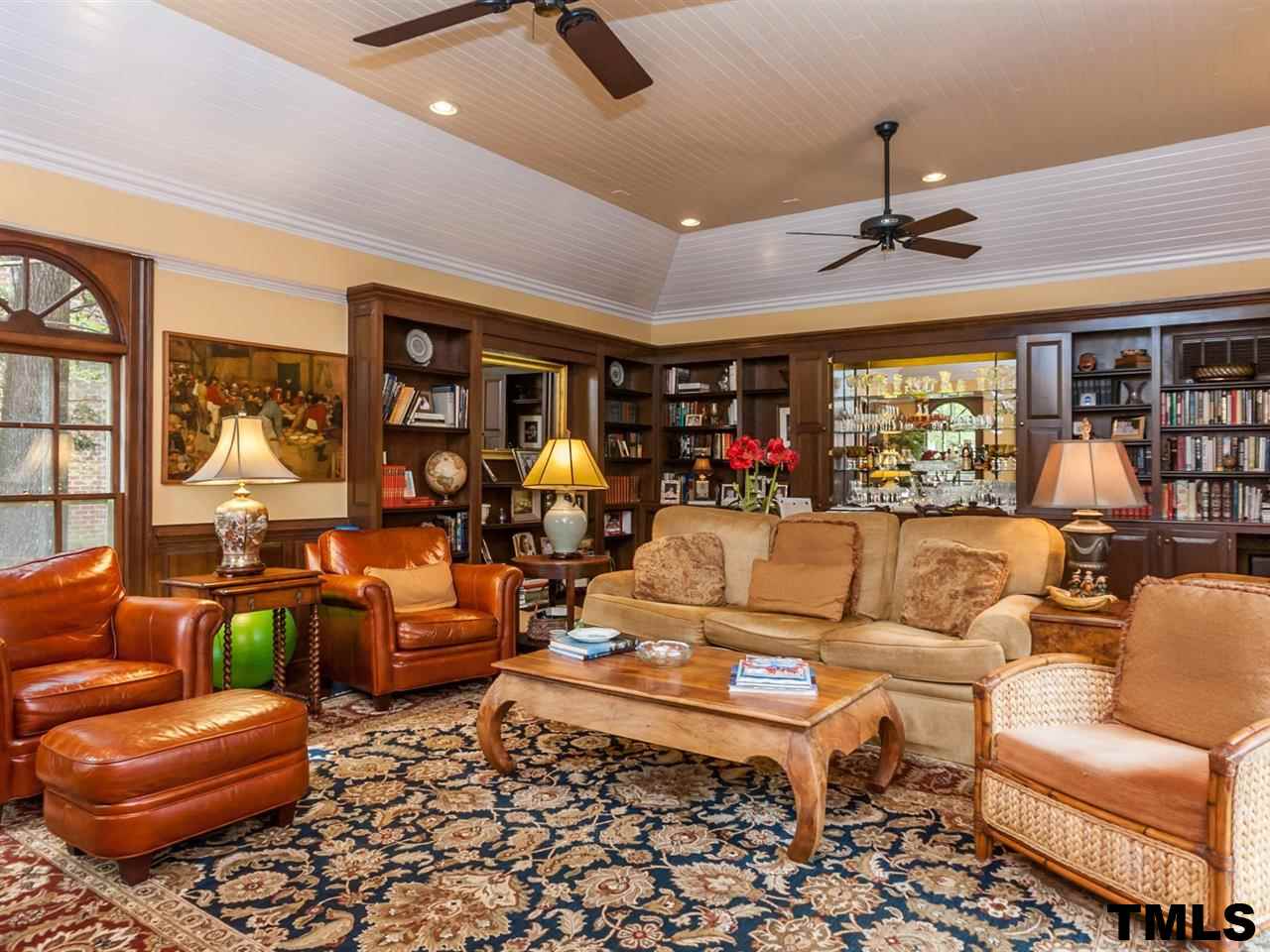 1804 Pony Run Road Raleigh, NC 27615 - Photo 7 of 25 a living room with furniture ceiling fan and a rug