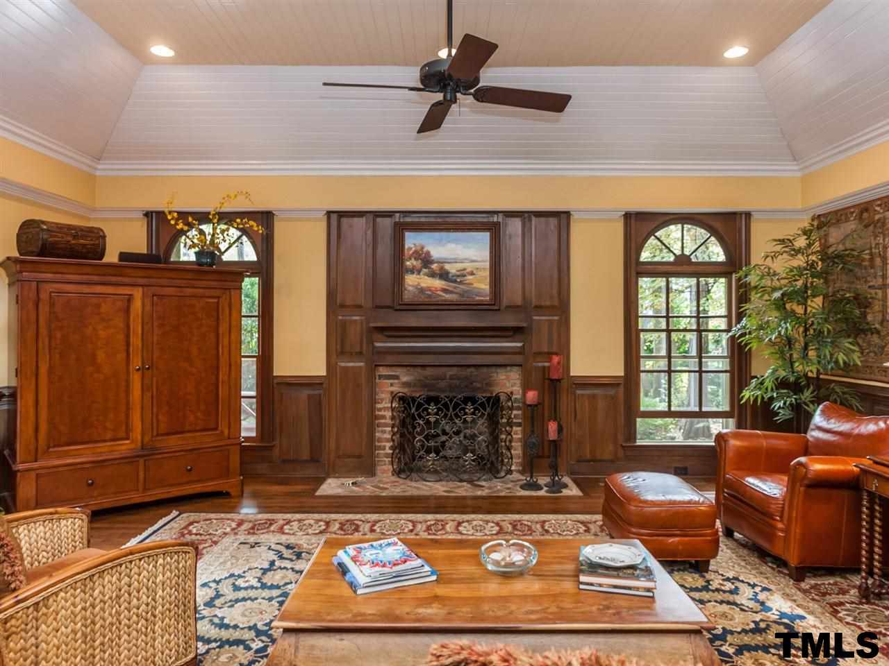 1804 Pony Run Road Raleigh, NC 27615 - Photo 8 of 25 a living room with furniture a rug and a fireplace