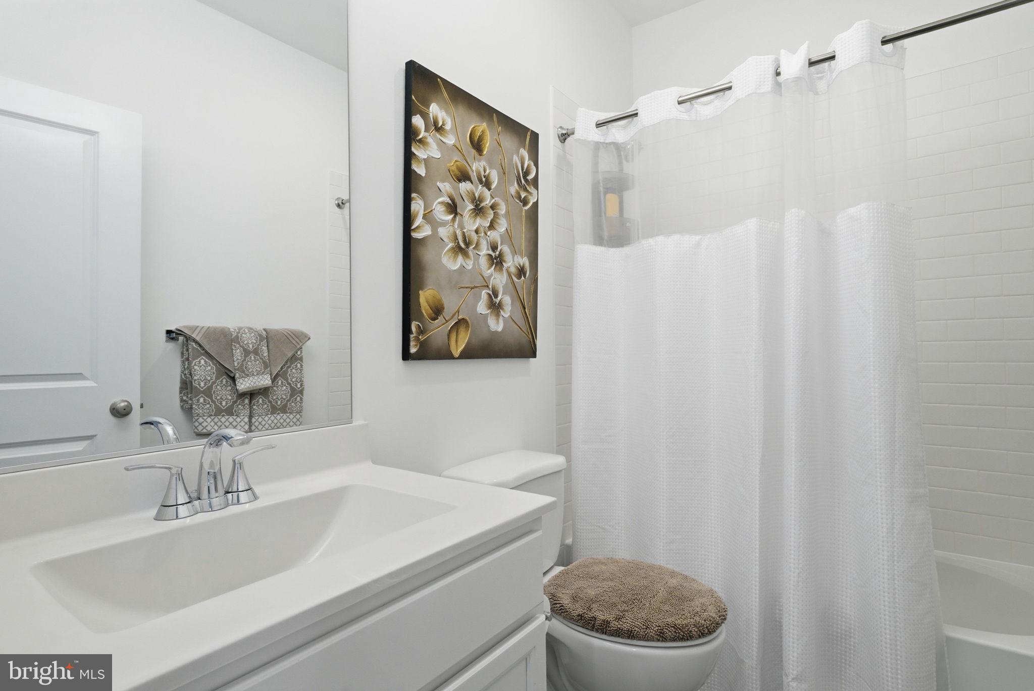 761 Elevation Road Frederick, MD 21702 - Photo 32 of 46 Serene bathroom with floral accents.
