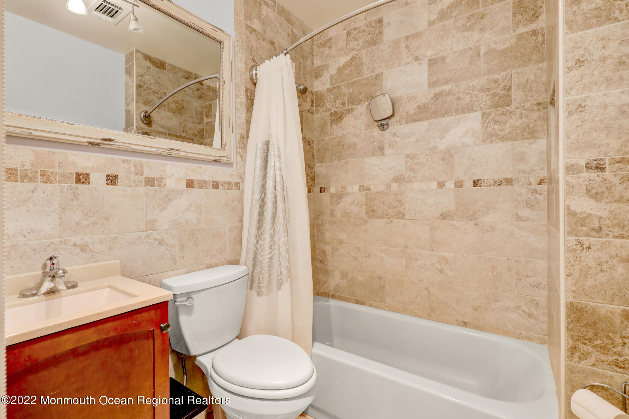 241 Timberline Road Toms River, NJ 08753 - Photo 23 of 29 a white toilet sitting next to a bath tub