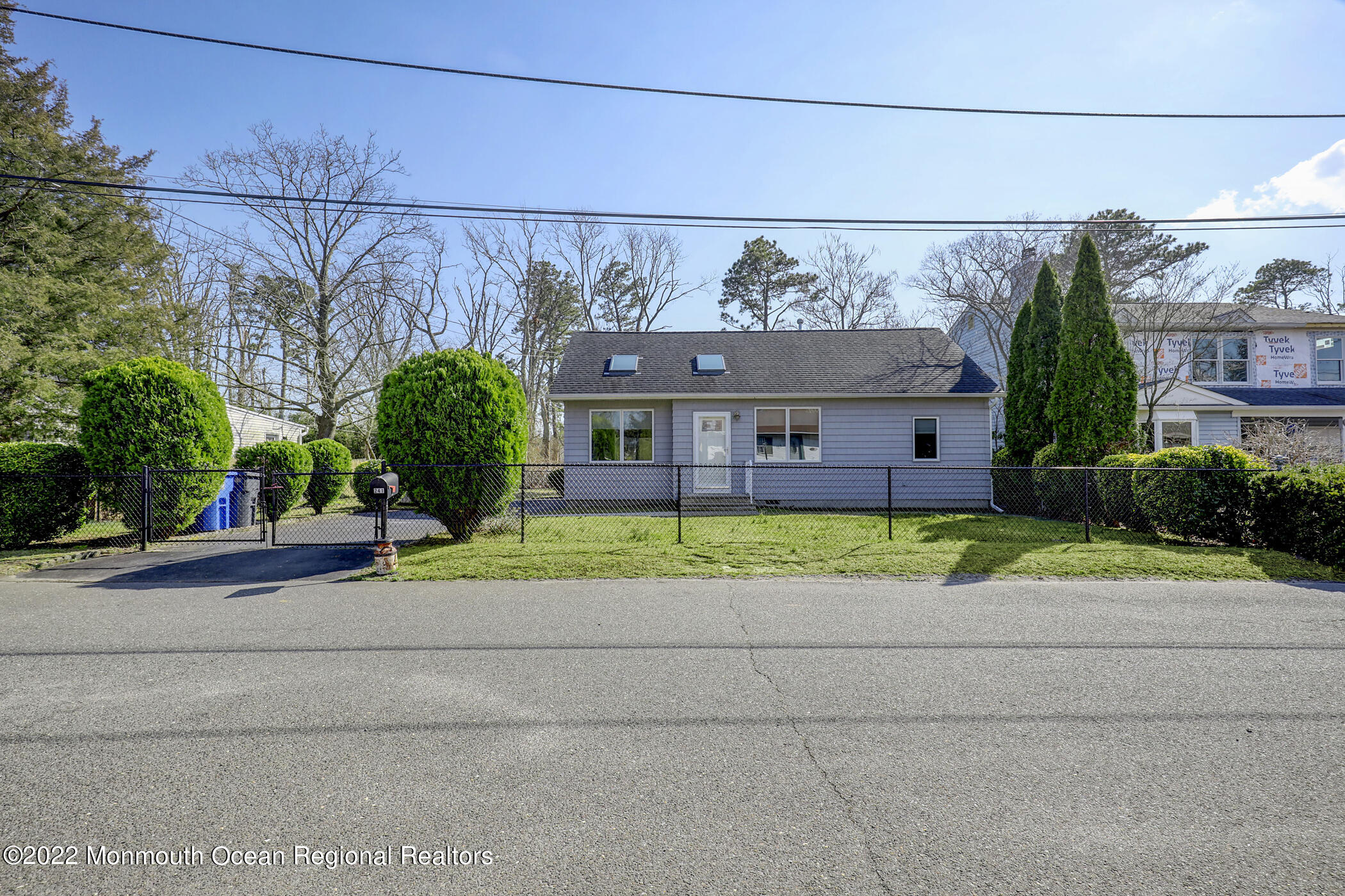 241 Timberline Road Toms River, NJ 08753 - Photo 3 of 29 a view of a brick house with a yard and large trees