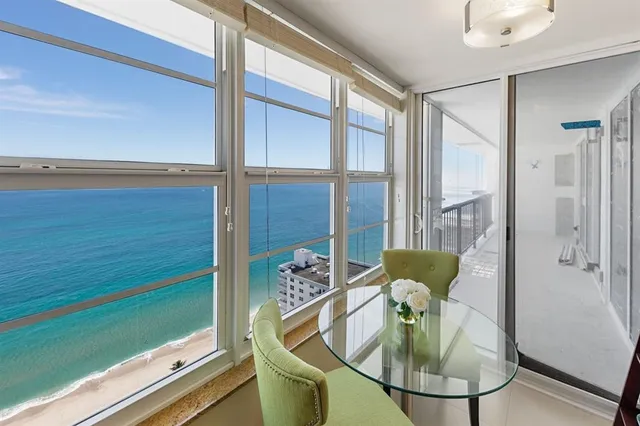 a spacious bathroom with a sink a toilet a large mirror and shower