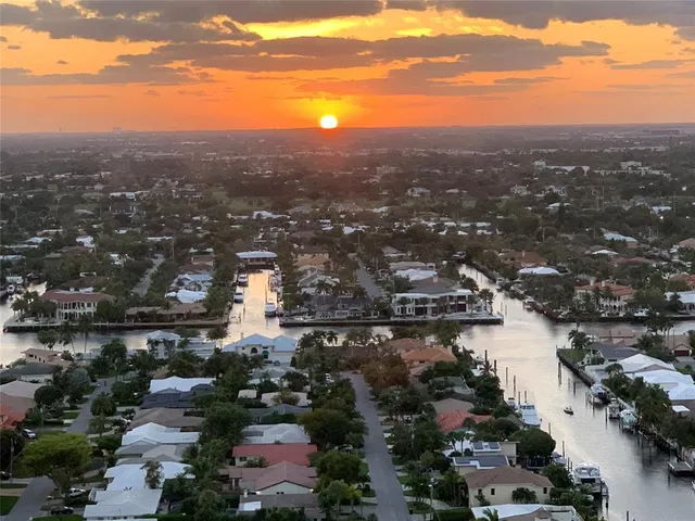 a view of a dining room with furniture wooden floor and chandelier