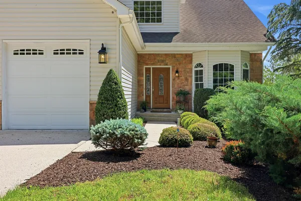 a view of front door and potted plants