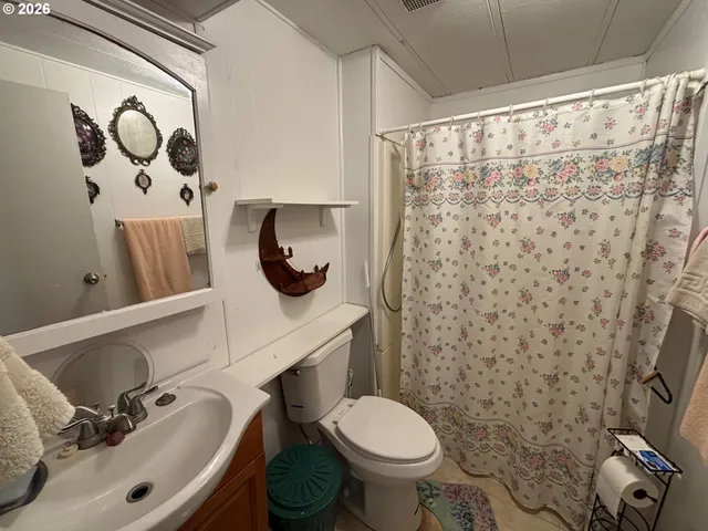 a bedroom with a bed and a walk in closet