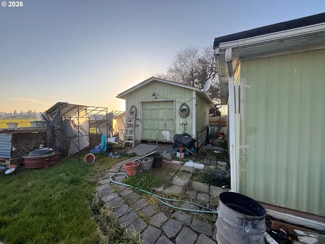 a backyard of a house with outdoor seating