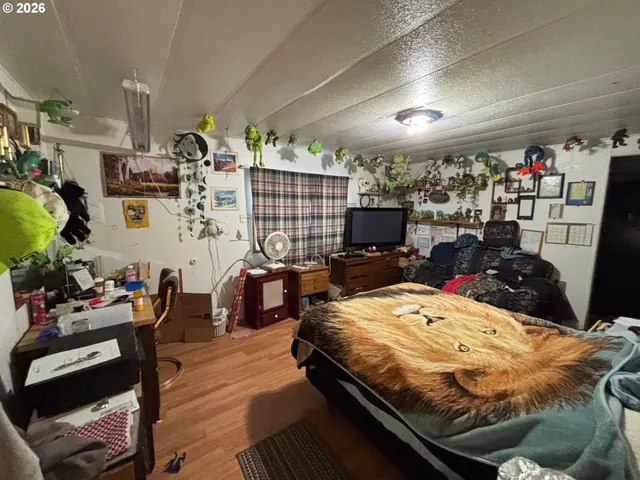 a room with furniture washer and flat screen tv