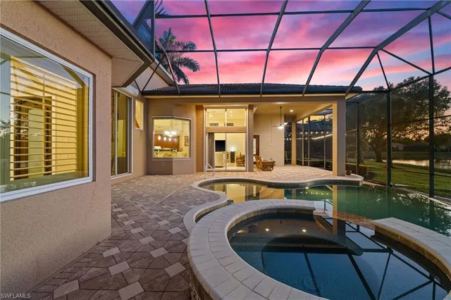 a view of a patio with a table and chairs