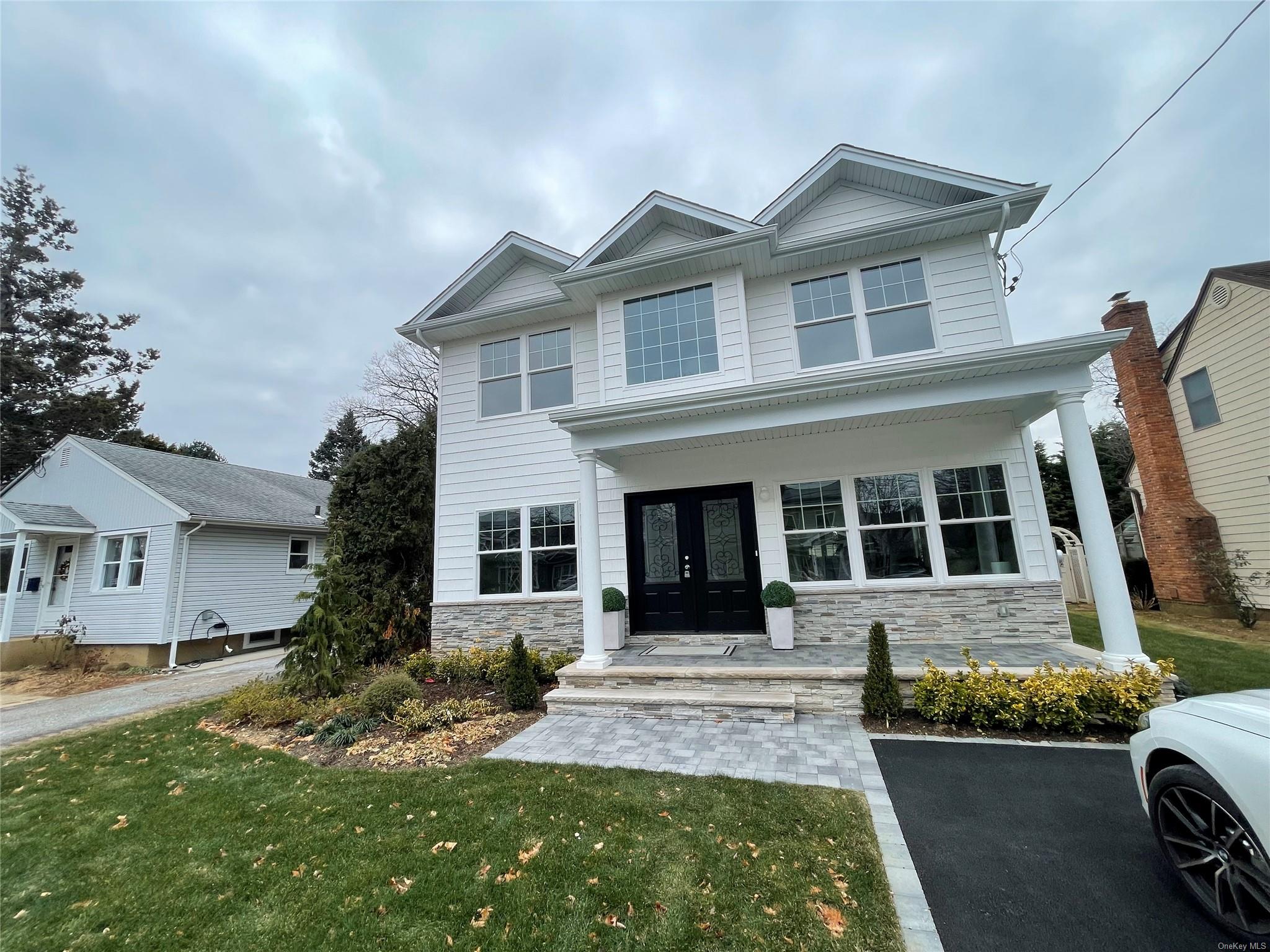 front view of a house with a yard