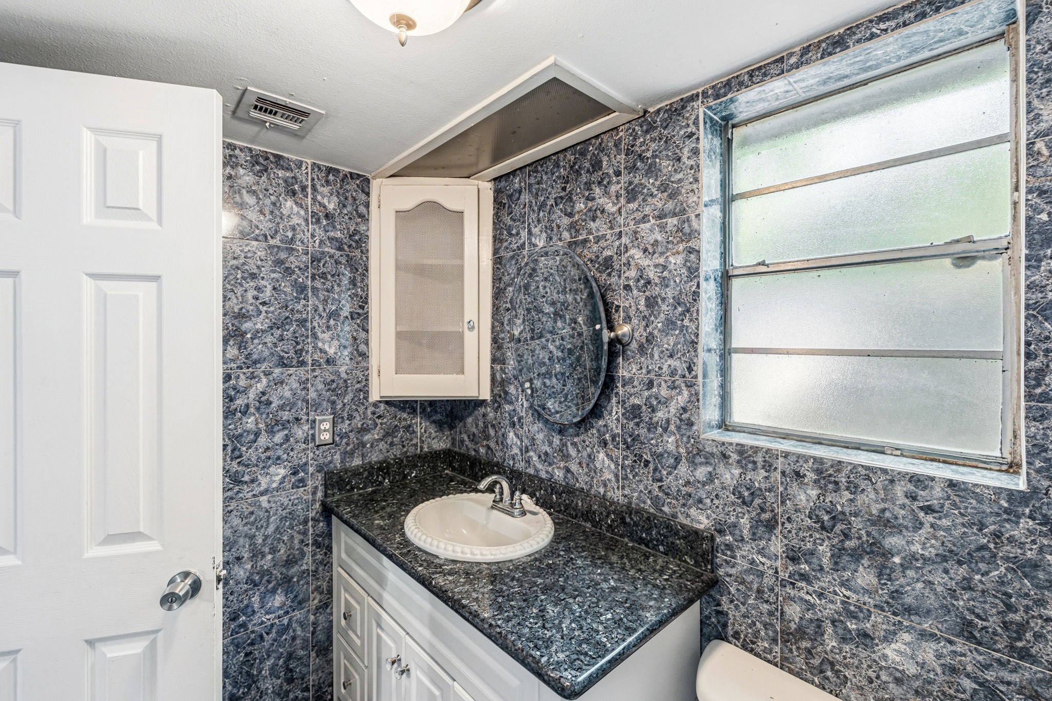 4422 Sandydale Lane Houston, TX 77039 - Photo 11 of 36 a bathroom with a sink and a mirror
