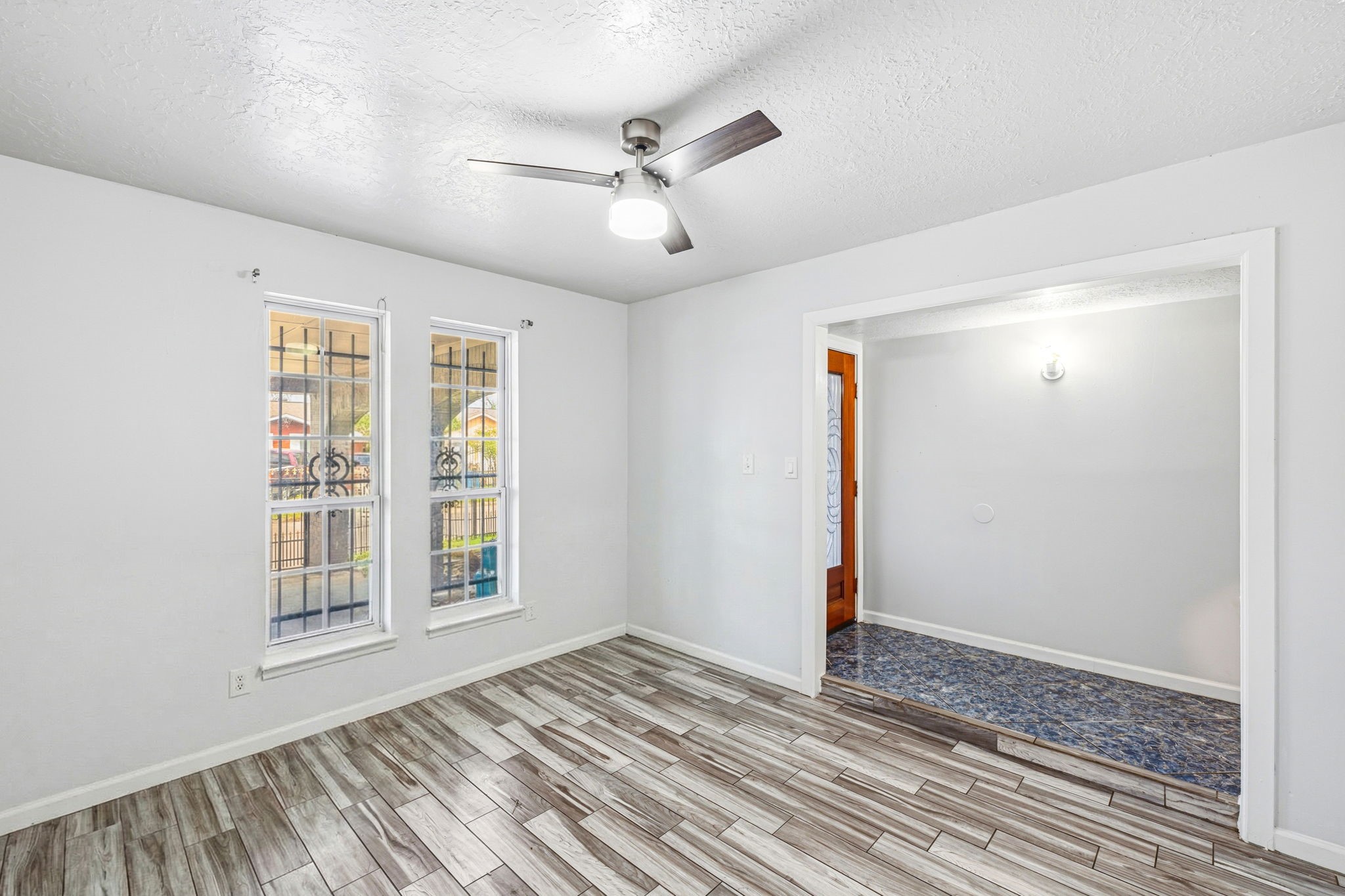 4422 Sandydale Lane Houston, TX 77039 - Photo 15 of 36 a view of an empty room with wooden floor and a window