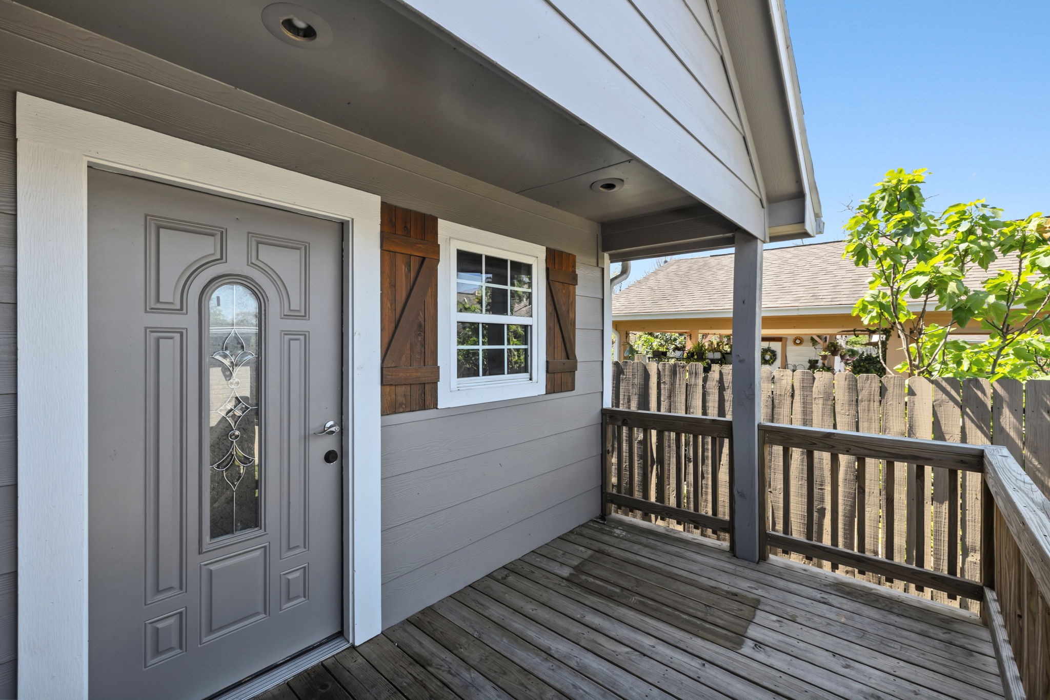 4422 Sandydale Lane Houston, TX 77039 - Photo 19 of 36 a view of a porch with wooden floor and windows