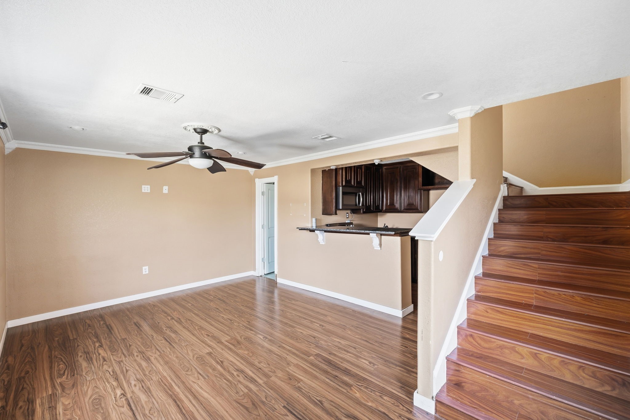4422 Sandydale Lane Houston, TX 77039 - Photo 21 of 36 a view of a hallway with wooden floor and staircase