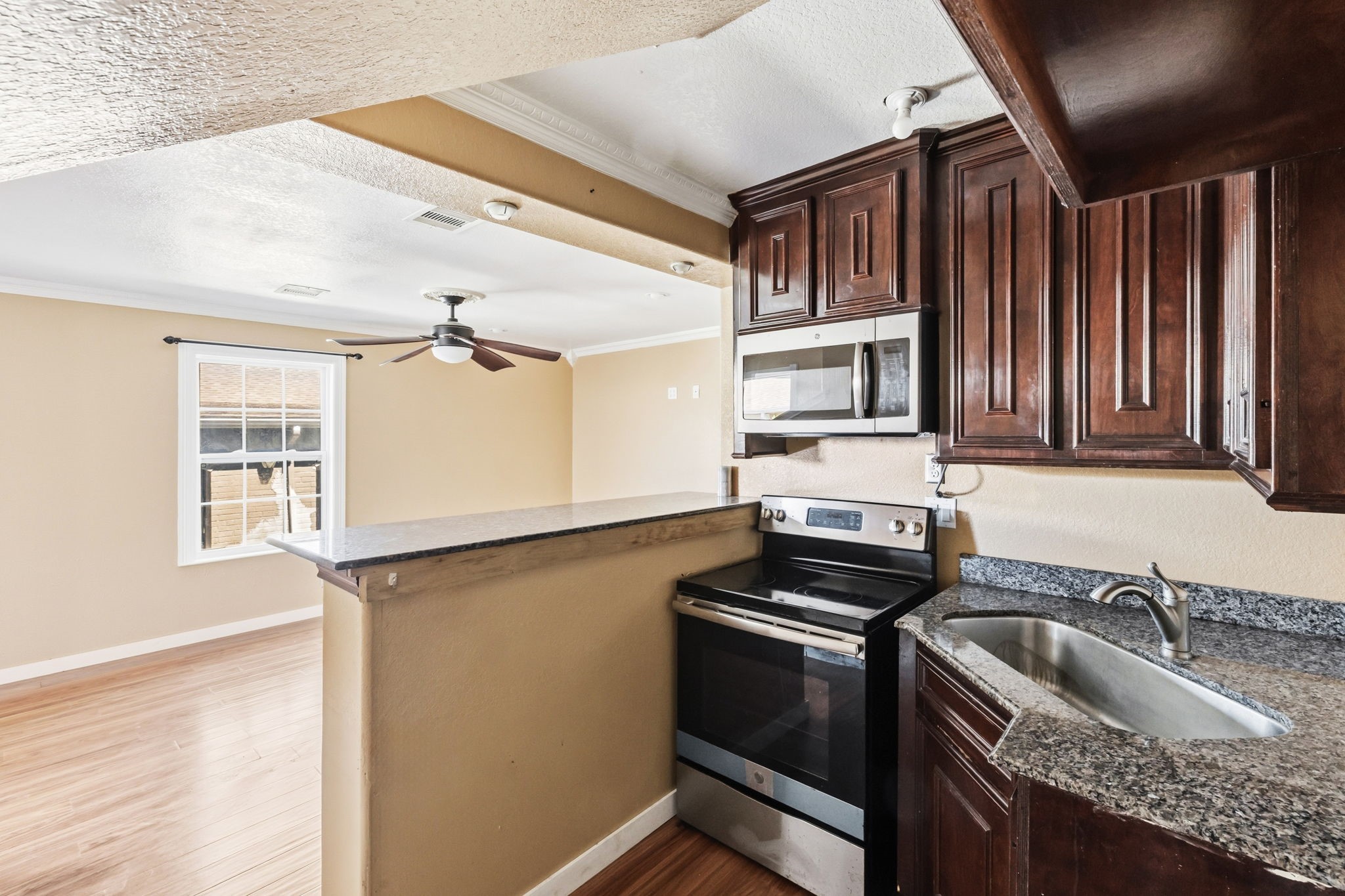 4422 Sandydale Lane Houston, TX 77039 - Photo 24 of 36 a kitchen that has a sink cabinets counter space and appliances
