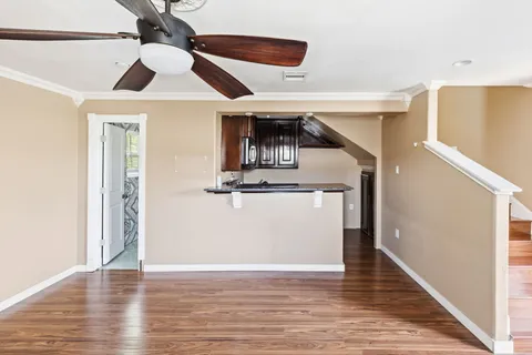 a view of a livingroom with wooden floor