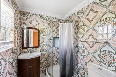 a bathroom with a sink and mirror