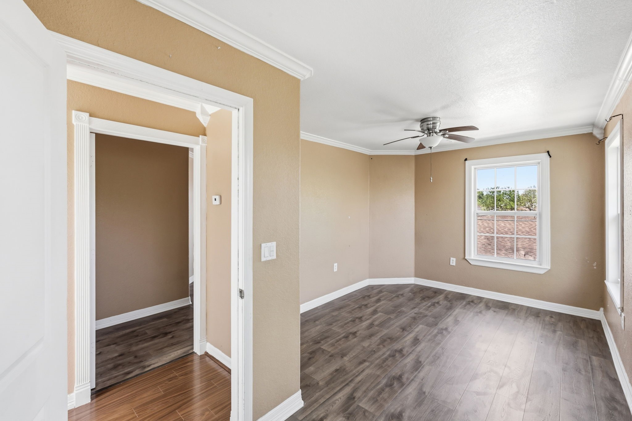 4422 Sandydale Lane Houston, TX 77039 - Photo 30 of 36 a view of an empty room with wooden floor and a window