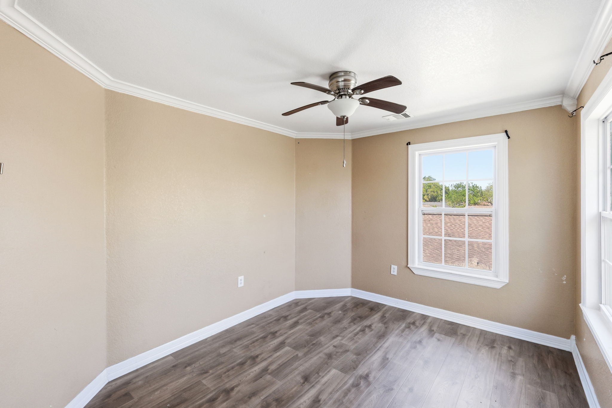 4422 Sandydale Lane Houston, TX 77039 - Photo 32 of 36 a view of empty room with wooden floor and fan