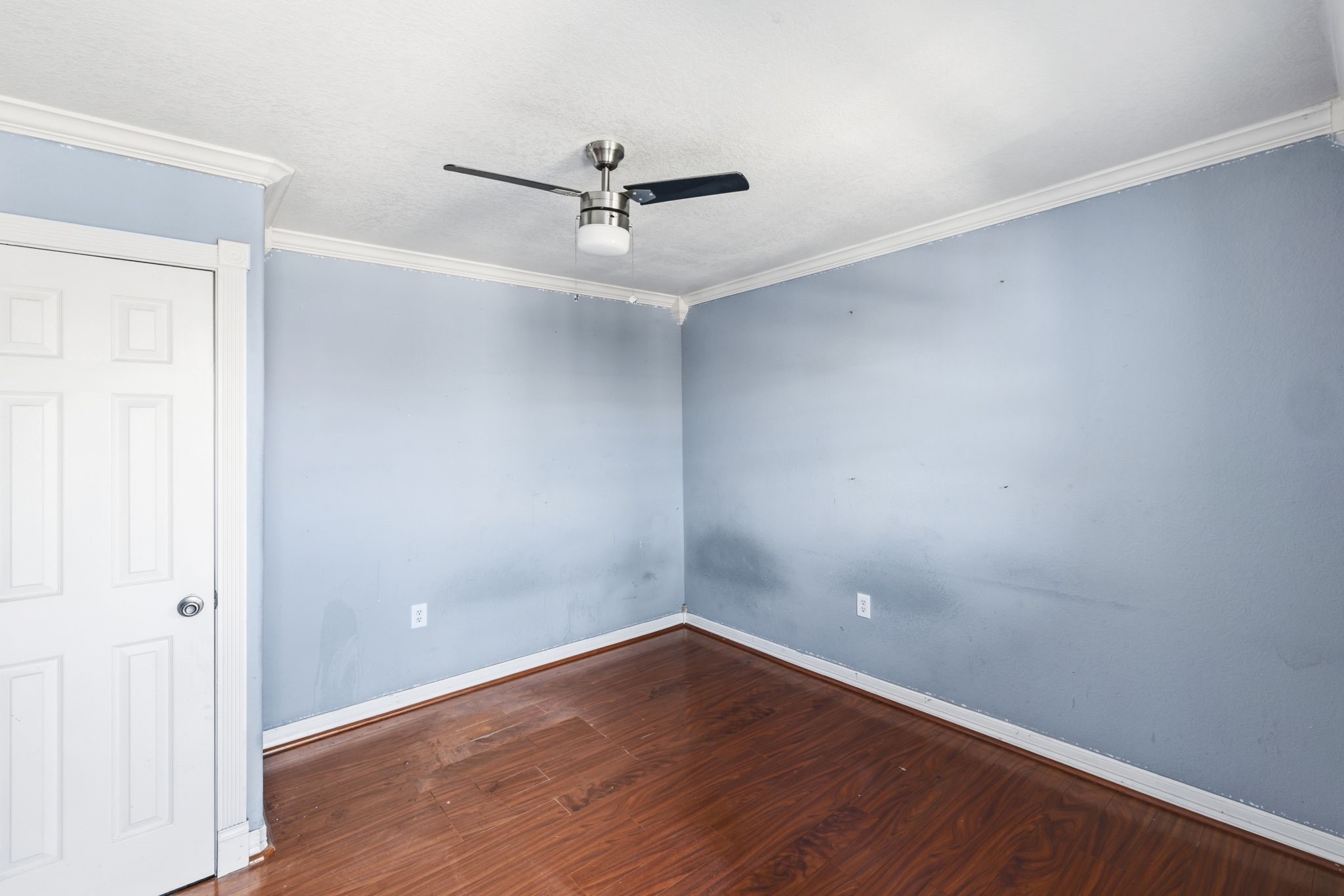 4422 Sandydale Lane Houston, TX 77039 - Photo 36 of 36 an empty room with wooden floor and ceiling fan
