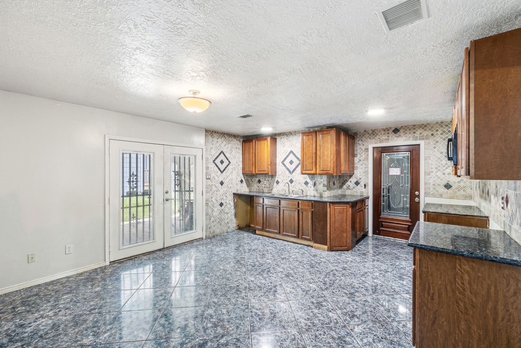 4422 Sandydale Lane Houston, TX 77039 - Photo 7 of 36 a view of a kitchen with a large window