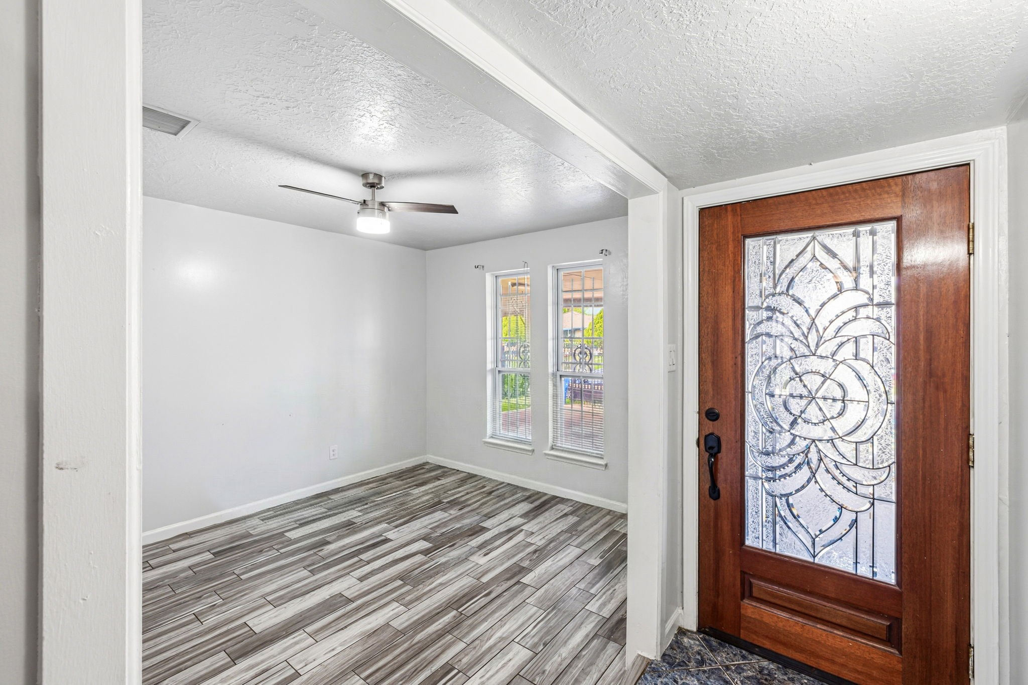 4422 Sandydale Lane Houston, TX 77039 - Photo 9 of 36 a view of a livingroom with wooden floor and a window
