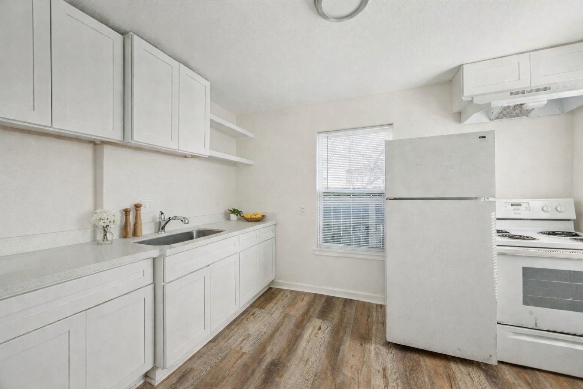 7019 Bonham Street Houston, TX 77020 - Photo 10 of 17 a kitchen with stainless steel appliances granite countertop a refrigerator and a stove top oven