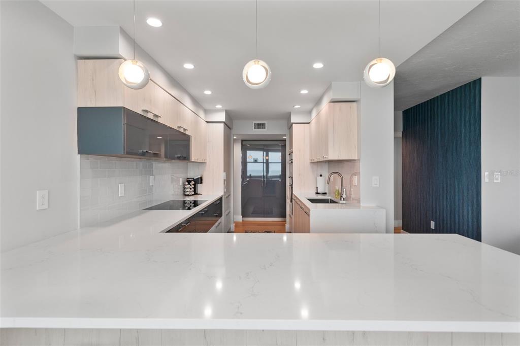 1050 Longboat Club Road, Unit 901 Longboat Key, FL 34228 - Photo 10 of 37 a large kitchen with stainless steel appliances