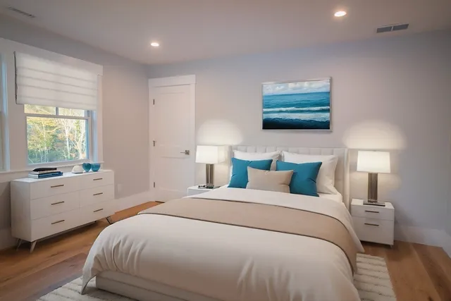 a bedroom with a bed and glass window