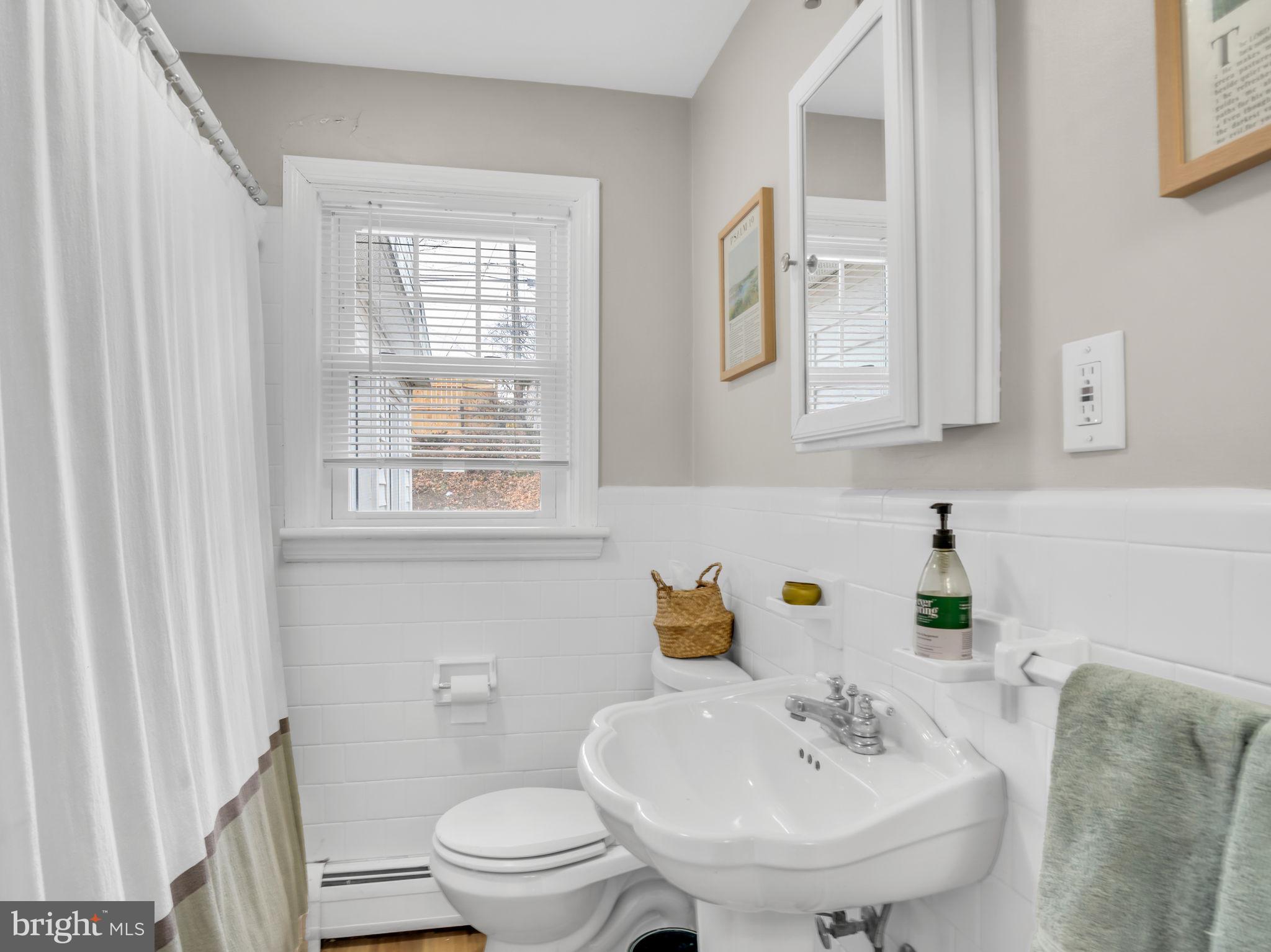 3500 Centerfield Road Harrisburg, PA 17109 - Photo 18 of 32 a bathroom with a sink a toilet and a mirror