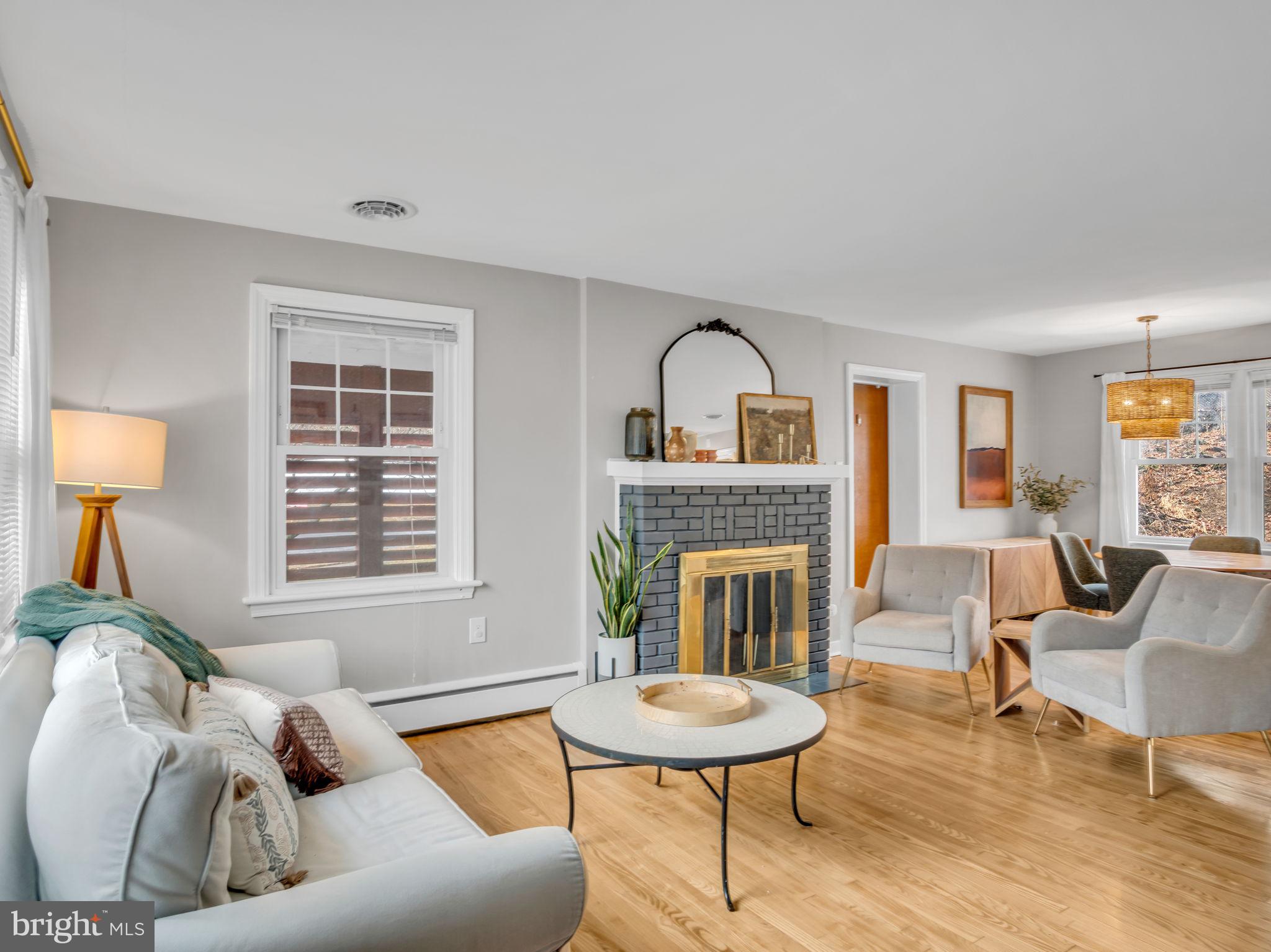 3500 Centerfield Road Harrisburg, PA 17109 - Photo 2 of 32 a living room with furniture and a fireplace